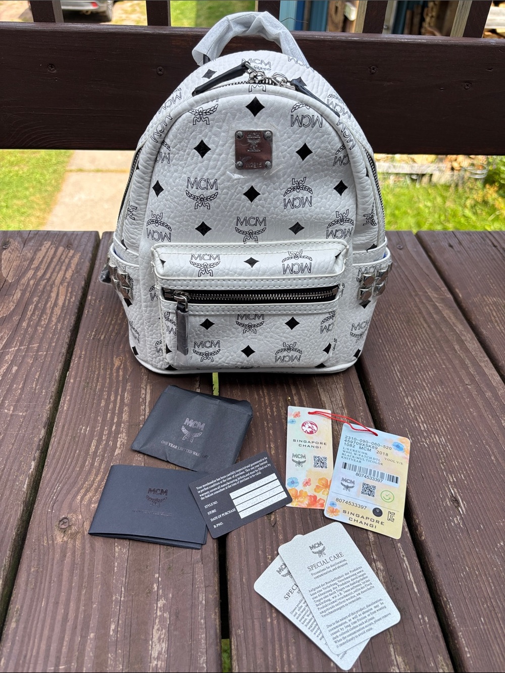 MCM White Visetos Mini Backpack with Black Logo Print and Silver Hardware